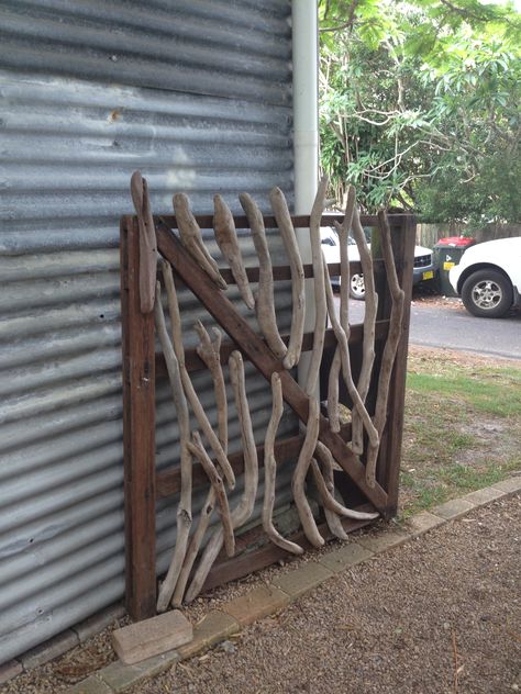 Driftwood gate Driftwood Gate Ideas, Driftwood Gate, Stick Fences, Pnw Garden, Rustic Wood Projects, Fence Diy, Gate Ideas, Driftwood Wall, Friday Harbor