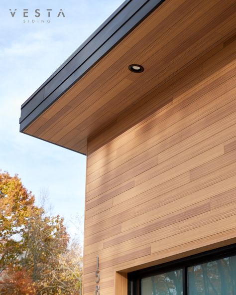 Warm-tone Gilded Grain Vesta was added to the exterior of this garage gravitating it toward a Mid-Century Modern design. To achieve this look on a variety of architectural styles, opt for Vesta siding with smooth profiles, and use a maximum of two orientations. This keeps things very streamlined and simple. Wood Siding Modern House, Vertical Cement Board Siding, Modern Home Siding, Diagonal Wood Siding Exterior, Modern Cedar Siding, Wood Soffit Exterior Modern, Wooden Soffit Exterior, Contemporary Siding Exterior, Wood Looking Siding Exterior