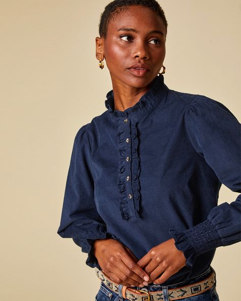 Our Kylie Corduroy Blouse is made from responsibly sourced cotton needlecord. Featuring a round neckline and half button-through placket edged with a single frill, full-length sleeves with smocking around the cuffs. ✨ #newin #cord #navy #blouse #top #sustainable #fashion #slowfashion #ethical #smallbusiness #ootd #styleinspo Mens Clothing Guide, Corduroy Blouse, Printed Blouses, Frill Collar, Clothing Guide, Tops And Blouses, Russell Westbrook, Navy Blouse, Blue Blouse