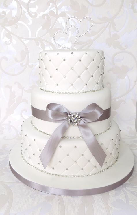 White Quilted Wedding Cake, with Diamantes, Brooch and Bow, with duo love heart topper Quilted Wedding Cake, Diamond Wedding Anniversary Cake, 60 Cake, Diamond Wedding Cakes, Quilted Cake, Cake Quilt, Bella Wedding, Fondant Wedding Cakes, Wedding Anniversary Cake