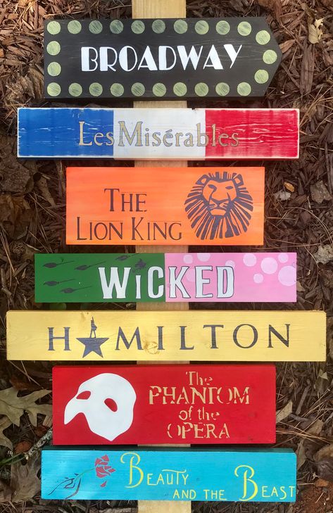 I started making these signs for my dear friend who is OBSESSED with Broadway musicals. I can do any of them you wish, just write me and tell me what you have in mind. These signs are $25 PER BOARD. PLEASE write to me and tell me how many you want and I will create a custom listing for you, otherwise your shipping will be crazy! The post is not included. Please also visit my Facebook page for tons of photos of my work. www.facebook.com/thetrashyside Broadway Musicals Party, Broadway Themed Room, Broadway Theme, Theatre Party, Theatre Classroom, Broadway Party, Broadway Theatre, Directional Signs, Broadway Musicals