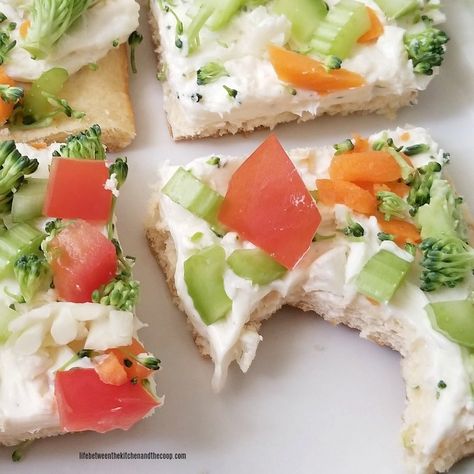 Enjoy delicious crescent roll crust with a yummy ranch cream cheese spread and lots of crisp fresh vegetables!  It makes a great party food as an appetizer or you can serve it as a main dish.  It's the perfect cool recipe for summer!  Just top it with your favorite chopped fresh veggies like carrots, broccoli, and celery.  Fresh tomato and cucumber taste great on it!  You will be amazed by how fast these disappear at your next party! Broccoli Cream Cheese Crescent Rolls, Veggie Squares, Veggie Crescent Bites, Roll Appetizers, Crescent Roll Appetizers, Crescent Roll Crust, Cucumber Appetizers, Tomato And Cucumber, Homemaking Skills