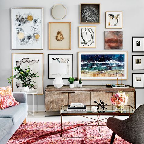 Spot the TV in this stylish art wall! #StyleAtHome created this fab look anchored around the #SamsungFrameTV (featuring a dark blue sea artwork) #mariepauleREALTOR #ArtWall Frame Tv Gallery Wall, Tv Gallery Wall, Standby Mode, Cheap Living Room Sets, A Frame Cabins, Modern Gallery Wall, Gallery Wall Living Room, Tv Wall Decor, A Living Room