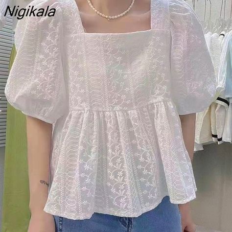 Pair a chic off-shoulder top with a flowing mini skirt and strappy sandals for a playful and fashionable summer look that’s perfect for warm weather. Cute Korean Tops, Korean Tops Outfits, College Wear Outfits, Korean Tops Blouse, Korean Tops For Women, Korean Clothing Brands, Square Form, Korean Blouse, Korean Top