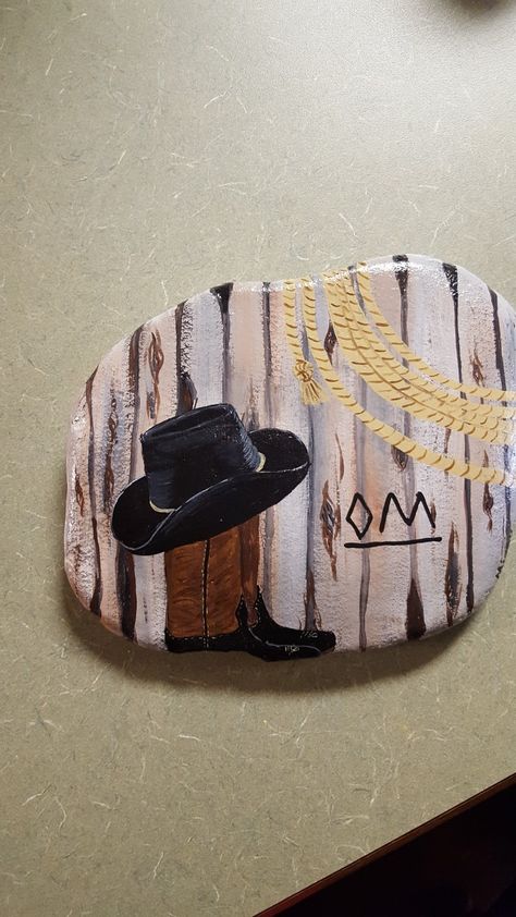 Cowboy hat and boots painted rock Western Rock Painting Ideas, Horse Rock Painting Ideas, Western Painted Rocks, Cowboy Painted Rocks, Southwestern Rock Painting, Hunting Rock Painting, Native Rock Painting, Horses Painted On Rocks, Rock Boots