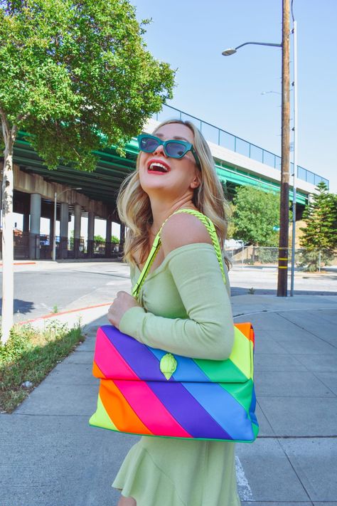 rainbow bag, cut out dress, spring dresses, braided leather heels, The Hunter Collector, colorful style, spring outfit ideas, green dress, green heels, green sunglasses Colorful Bags Outfit, Neon Bag Outfit, Karl Bags, Best Purses For Everyday, Colourful Closet, Rainbow Purses, Heels Green, Purse Outfit, Multi Colored Bag