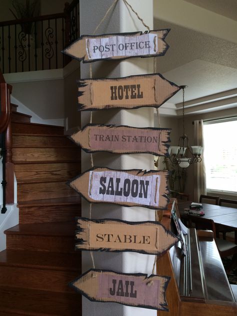 Directional signs.  Print words in different papers then glue to cardboard Rodeo Signs Diy, Diy Directional Sign Post Cardboard, Direction Signs Diy, Cardboard Sign, Cardboard Signs Diy, Rodeo Signs, Western Party Signs, Diy Western Party Decorations, Western Centerpieces