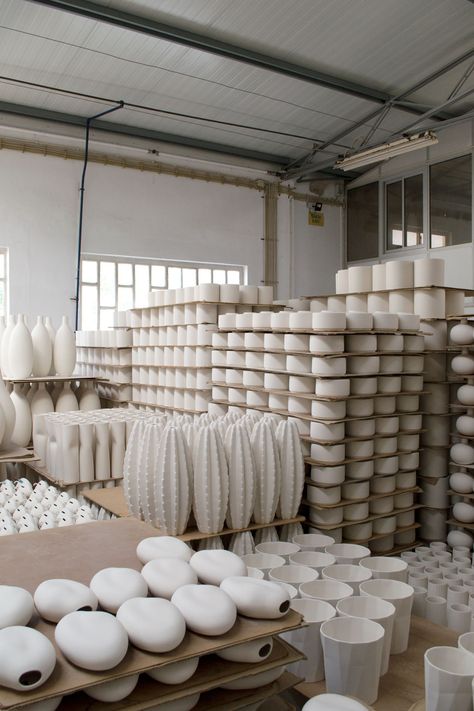 Stacks of white bisque ceramics waiting for glazing in the ceramics factory in Portugal. #ceramics #portugal #meetthemaker #handmade Ceramic Products, Ceramic Store Interior Design, Pottery Factory, Ceramic Exhibition Display, Portugese Ceramics, Wedding Table Vases, Portugal Ceramics, Hand Made Ceramic Jar, Concrete Molds Diy