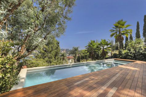 Outdoor, Decking Patio, Porch, Deck, Large Patio, Porch, Deck, Large Pools, Tubs, Shower, Back Yard, Trees, Shrubs, and Swimming Pools, Tubs, Shower The pool with a view. Photo 15 of 15 in A Thoughtfully Updated Hillside Home in L.A. Lists For $5.12M Pool With Wood Decking, Wood Decking Around Pool, Pool Built Into Deck, Pool Deck Wood, Wood Deck Pool, Pool With Wood Deck, Hillside Deck, Wood Pool Deck, Yard Trees