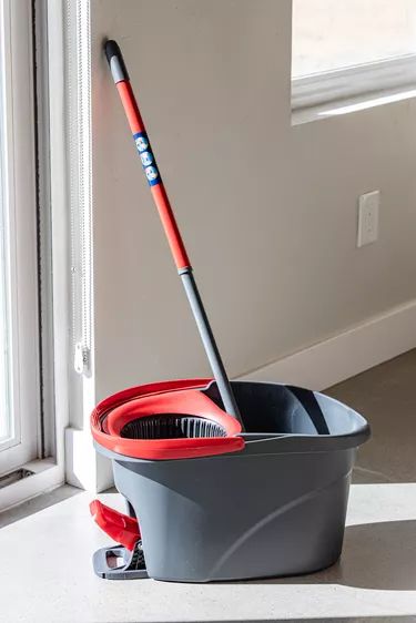 Spin Mop Cleaning Solution That Cleans Floors Like Crazy Tutorial | Hunker Best Homemade Mopping Solution, Moping Floors Cleaning, Spin Mop Cleaning Solution Diy, Spin Mop Floor Cleaner Recipe, Floor Mopping Recipes, Mop Bucket Cleaning Solution, Best Way To Mop Floors, Best Mopping Solution For Hardwood, Cleaning Solution For Ocedar Mop