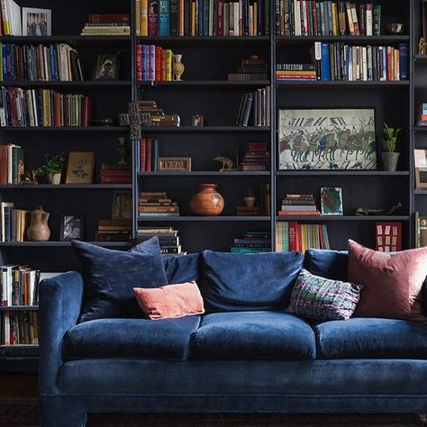 These bold black built-ins are giving us life. (The navy velvet sofa isn't too bad, either.) Tour the family home of @melluna, 1/3 of @littlejoynyc, via the link in our bio! Photo by @aaronbengo #SOdomino #Regram via @dominomag Minimalist Living Room Decor, Blue Velvet Sofa, Trending Paint Colors, Living Room Decor Ideas, Home Libraries, Nyc Apartment, First Apartment, Room Decor Ideas, Minimalist Living