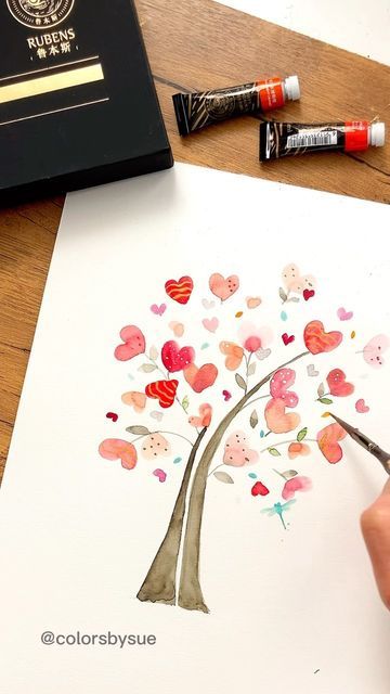 Sue Miano on Instagram: "Hearts are blooming. I used a newly released @paulrubensart ‘s watercolor tubes for this painting. . . . . . . . #colorsbysue#paulrubens #paulrubensart #watercolorreels #paintingreels #paintingtutorial #watercolourtutorial #arttutorial #valentineideas #heartart #beginnerwatercolor #watercolorbeginner #simplewatercolor" Watercolour Hearts Painting, Easy Valentine Watercolor, Watercolour Heart Painting, Index Card Art Ideas, Valentines Watercolor Painting Ideas, Valentine Watercolor Cards Watercolour, Valentine Watercolor Ideas, Watercolor Valentines Art, Watercolor Valentine Cards Diy