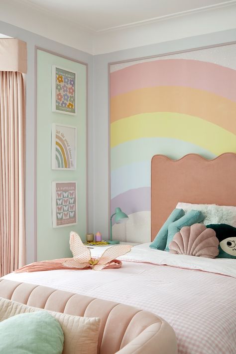 Pastel sweetness! Perfect fit for a little girl's bedroom. Statement mural paired with soft fabrics and an array of visually appearing accessories. Design by London-based Joanna Landais of Eklektik Studio - specialising in interiors exclusively for children. #rainbowroom #girlsbedroom #rainbowmural #rainbowwallpaper #pastelroomforgirls Teenage Rainbow Bedroom, Pastel Girls Bedroom Ideas, Sprinkle Bedroom Ideas, Girls Pastel Bedroom, Rainbow Pastel Bedroom, Rainbow Childrens Bedroom, Rainbow Inspired Bedroom, Kids Pastel Bedroom, Girls Bedroom Rainbow