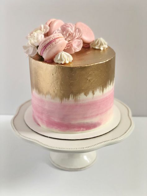 Pink cake with gold painted on top and down the sides, topped with macarons, meringues and flowers. Pink Cake With Macarons, Birthday Cake With Macarons On Top, Cakes With Macarons On Top, Gold Ombre Cake, Cake With Macarons On Top, Macaron Cakes, Cake With Macarons, Cake With Gold, 11 Birthday