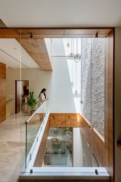 Narrow House Is A Unique Example Of Balancing The Yin And The Yang Of Architecture | Prashant Parmar Architect & Shayona Consultant - The Architects Diary Prashant Parmar, Sustainable Living Room, Skylight Design, Narrow House Designs, Narrow House Plans, Glass Railings, Stairs In Living Room, Brick Cladding, Courtyard Design