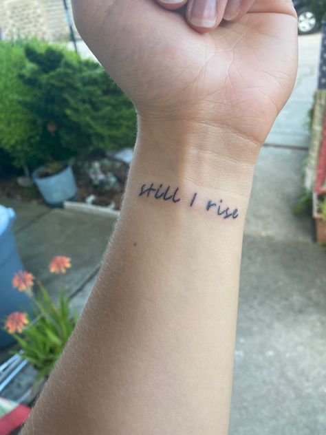 Tattoo, new tat, still i rise. #tattoo #tattooideas #aesthetic #aestheticfeed #newtattoo Still I Rise Tattoo With Cross, Still I Rise Wrist Tattoo, Im Still Here Tattoo, Still I Rise Tattoo Design, And Still I Rise Tattoo, Still I Rise Tattoo Fonts, Still Here Tattoo, Strong Female Tattoos, Rise Above Tattoo