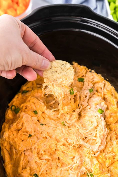 Slow cooker buffalo chicken dip in the slow cooker only needs five easy ingredients to make a creamy dip perfect for game day and parties. Buffalo Chicken Dip Sour Cream, Buffalo Chicken Dip Mini Crock Pot, Slow Cooker Buffalo Chicken Dip With Raw Chicken, Healthy Buffalo Chicken Dip Crock Pot, Buffalo Chicken Dip With Blue Cheese, Crockpot Chicken Buffalo Dip, Easy Buffalo Chicken Dip Crock Pot, Crockpot Chicken Wing Dip, Chicken Buffalo Dip Crockpot