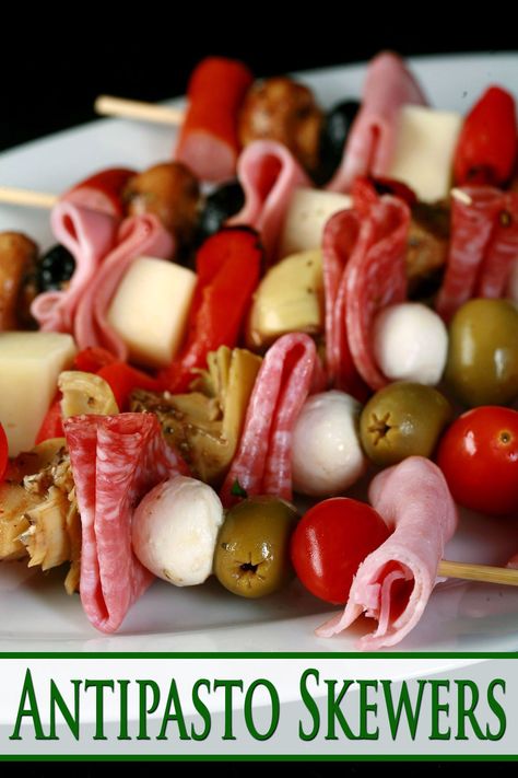 Several antipasto skewers - meats, cheeses, olives, and more - on a plate. Skewers Appetizers Cold, Make Ahead Skewers, Antipasto Mushrooms, Italian Antipasto Skewers, Antipasta Skewer, Vegetarian Antipasto Skewers, Antipasto Kabobs, Charcuterie Appetizers, Antipasto Skewers