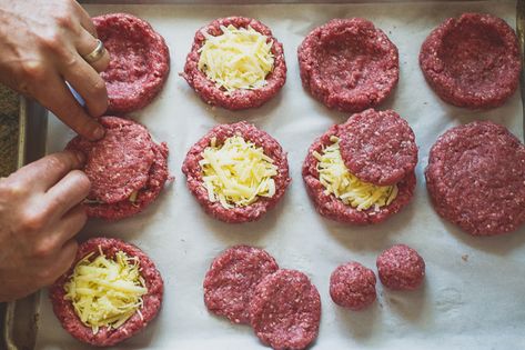 The Juicy Lucy Burger with melted cheese oozing from the center of the patty. Recipe from White On Rice Couple Profile Recipes, Juicy Lucy Burger, Patty Recipe, Burger Party, Hamburgers Grilled, Gf Food, Juicy Lucy, Bento Ideas, Hamburger Recipes