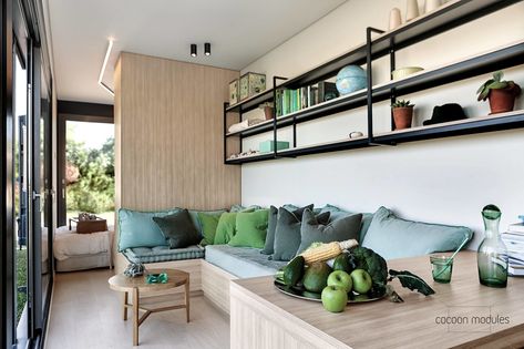 A bright, modern shipping container home from Greek builder, Cocoon Module. A beautiful eco-friendly space with a live roof! Tiny Sofa, Container Home Designs, Container Homes Cost, Tiny House Living Room, Light Hardwood Floors, 7 Design, Container Architecture, Casa Container, Shipping Container House