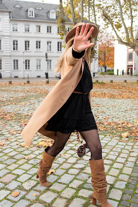 A pretty easy outfit today, with a lovely Loavies black dress and camel accessories.You probably now those Stradivarius boots now. What I love about it, is that you can wear them either as thigh high boots or just under the knees.    Hat : The Kooples  Coat : Comptoir des Cotonniers  Dress : Loavies  Belt : H&M  Boots : Stradivarius  Bag : Zara    #fallootd #falloutfit #falllook #streetstyle #parisianstyle #idéelook #tendancemode #lookautomne Tan Boots And Belt, Taupe Long Boots Outfit, Tan Calf Boots Outfit, Camel Tall Boots, Khaki Knee High Boots Outfit, Tan Knee Boots Outfit, Camel High Boots Outfit, Knee High Beige Boots Outfit, Long Tan Boots Outfit