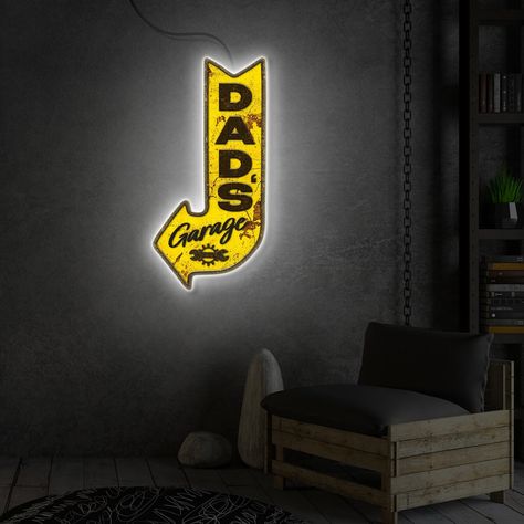 🔧 Transform your dad's haven into a personalized retreat with our "Dad's Garage" Neon Light Sign - a dynamic fusion of nostalgia and modern flair that adds a touch of character to his cherished space! 🌟 Featuring the unmistakable glow of "Dad's Garage" LED Sign, this customized masterpiece is more than just a sign; it's a tribute to the cherished memories and countless hours spent tinkering in the workshop. ✨ Key Features: - Customized Elegance: Our Garage LED Sign allows you to create a perso Custom Garage Signs, Art Garage, Garage Wall Decor, Led Art, Arrow Art, Custom Garages, Dads Favorite, Garage Signs, Vintage Aesthetics