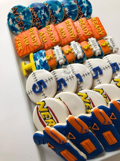 7th Birthday Themes For Boys, Boy 9th Birthday Party Themes, 6 Year Birthday Party Ideas Boy, Nerf Cookies Decorated, 6th Birthday Boy Theme, Nerf Cakes For Boys, Nerf Cookies, Boys Nerf Birthday Party, Nerf Birthday Party Ideas Food