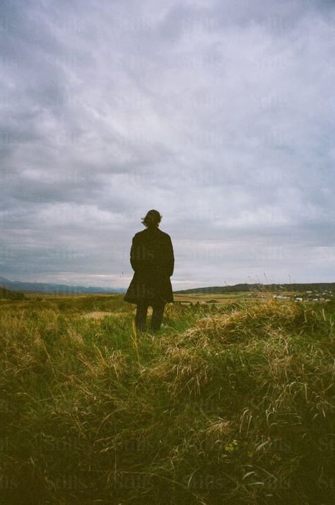 by Kristina Kulakova | Available to license on stills.com Looking Into The Distance, A Person Standing, Man Kneeling, Standing In A Field, Field Photos, Towards The Sun, Image Reference, Person Standing, Stock Images