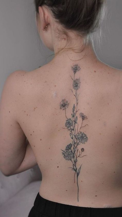 Sculpt elegance along your spine: Spine tattoo ideas. Explore designs that accentuate the beauty of your back with grace and style. Tattoo Women Flower, Spinal Tattoo Women, Tattoo Ideas Inspiration, Spinal Tattoo, Flower Spine Tattoos, Spine Tattoo Ideas, Tato Minimal, Small Pretty Tattoos, Petite Tattoos