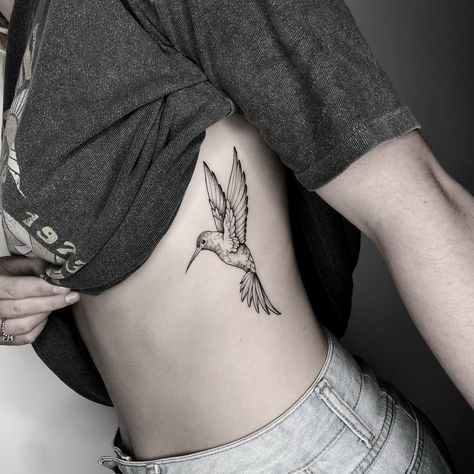 Hummingbird Side Tattoo, Angel Hummingbird Tattoo, Woman Inner Bicep Tattoo, Hummingbird Tattoo On Leg, Wildflower Hummingbird Tattoo, Below Chest Tattoo Female, Humming Bird Shoulder Tattoos For Women, Hummingbird Daisy Tattoo, Hummingbird Tattoo On Ankle