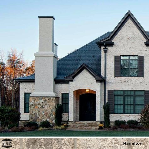 If you could only describe this house in one word, what would it be? Our word is STUNNING! The soft coloration of our Cortez brick is offset by modern, iron-clad windows and a mix of stucco and stone, giving this home its must-have appeal. #homeexterior #brick #homeinspiration #northgeorgia brick  https://bit.ly/3dws0Gi Brick And Stone Exterior Combinations, Modern Farmhouse Living Room Decor, Light Brick, Brown Brick, Classic Window, Stucco Exterior, Brick Exterior House, Modern Farmhouse Living Room, White Brick