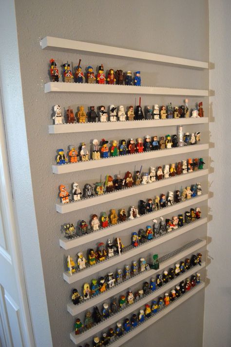 Very cool!!! However, it would probably be easier and safer for the wall to create the shelving as one piece vs individual shelves as it appears here.                           * think smarter, not harder * Lego Shelf, Lego Bedroom, Lego Organization, Lego Wall, Lego Display, Lego Room, Lego Storage, Lego Minifigure, Kids Room Wall