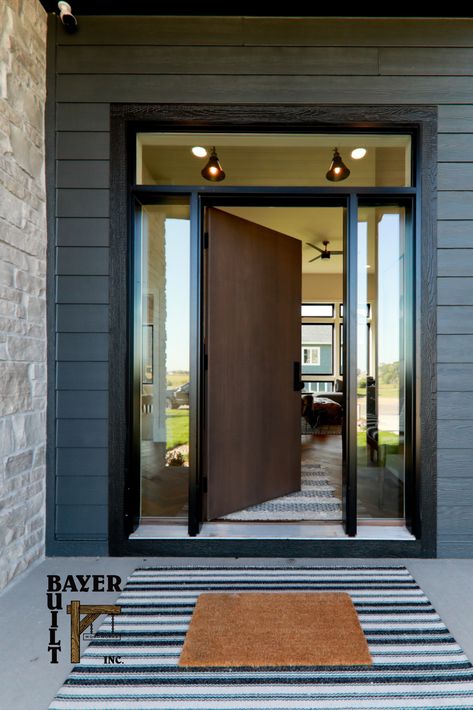 Does your front door say, "Welcome,"...it should and ideally, it should also be representative of your home's style. Let us help you find a door that inspires. Oversized Wood Front Door, Oversized Entry Door, Extra Tall Front Door, Farmhouse Modern Front Door, Modern Cabin Front Door, Windowless Front Door, Modern Cottage Front Door, Mid Century Modern Front Door With Sidelights, Exterior Door In Bedroom