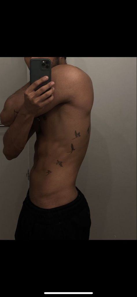 Bird tattoo Bird Side Tattoo Men, Bird Tattoo Men Back, Small Tattoos For Men Birds, Mens Birds Tattoo, Men’s Bird Tattoo Arm, Birds On Ribs Tattoo Men, Men Ribs Tattoo Ideas, Flock Of Birds Tattoo Men, Birds On Side Tattoo Men