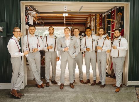 Light gray suit, brown leather suspenders, peach bow ties Light Grey Suit Men Wedding With Suspenders, Grey Suits With Suspenders, Groomsmen Leather Suspenders, Groomsman Bow Tie, Light Gray Groomsmen Suits Suspenders, Grey And Brown Groomsmen Attire, Light Brown Groomsmen Attire, Gray Groomsmen Attire Suspenders, Tan Suit Suspenders Wedding