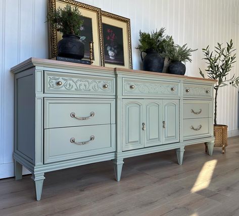 || SOLD || ✨SOFT, MUTED SAGE GREEN SIDEBOARD/DRESSER✨ This is 74 inches of pure excellence! Excellent design, excellent construction, excellent craftsmanship. Triple dresser/sideboard made by Thomasville. Featuring 9 drawers and dove tailed joinery. Perfectly ornate and offering lots of storage. I chose a soft, muted sage green for this and paired with a light and subtle toned gold for the hardware. Top is done in a neutral and light tone, featuring the beautiful grain of cherry. Meas... Green Sideboard, Dresser Sideboard, Sideboard Dresser, Muted Sage Green, Muted Sage, Triple Dresser, Dining Room Design, Joinery, Sage Green