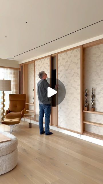 KJ Remodeling of NY on Instagram: "Our clients wanted to hide their TV, so we created this beautiful accent wall incorporating custom sliding paneling, which design cohesively blends into the rest of the room. Instead of constructing a full wall built-in, we saved a bit of space, made it look streamlined, yet custom and glamorous at the same time.   What do you guys think?   GC: @kjremodeling  Design: @ericamillardesign  Architecture: @manningsilverstein   #tvwall #tvwalldesign #mediawall #nycconstruction #nyccontractor #nycdeveloper #nycinteriordesign #nycarchitecture #nycarchitect #nycrealestate #luxuryhomes #luxuryapartments #kitchendesign #newyorktownhouse #interiordesign #interiordesigner #decor #interiorstyling #homerenovation #apartmenttherapy #houserenovation #bathroomdesign #moder Tv Room Panelling, Sliding Tv Wall, Hide Tv On Wall, Hide Tv Wall, Full Wall Paneling, Tv Wall Design Modern Luxury, Luxury Tv Wall, New York Townhouse, Nyc Interior Design