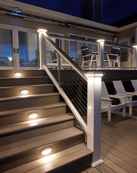 Add a soft, subtle glow to your deck with lighted island caps. Perfect for creating evening ambience. Easy on the Eyes Lights shine downward for a delicate radiance. A Subtle Glow Creates a slightly softer effect than a Post Cap Light. A Perfect Fit Fits beautifully with 5.5” post sleeves and post caps. Beautifully Integrated Designed to seamlessly coordinate with TimberTech Riser Lights, Under-Rail Lights, and Accent Lights. Low-Voltage Wiring 12 volts AC Raised Decks Backyard, Front Porch Post And Railing Ideas, Deck Stair Lighting Ideas, Back Steps To House, Front Step Railing Ideas, Deck With Ramp, Timbertech Deck Ideas, Second Floor Deck Ideas, Deck Stairs Ideas