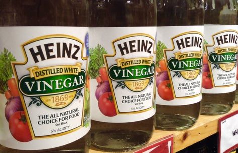 Shelf of bottles of Heinz distilled white vinegar Clean Armpits, Armpits Smell, Apple Cider Vinegar Remedies, Vinegar Uses, Vinegar Cleaning, Sweat Stains, Vinegar And Water, Distilled White Vinegar, How To Remove Rust