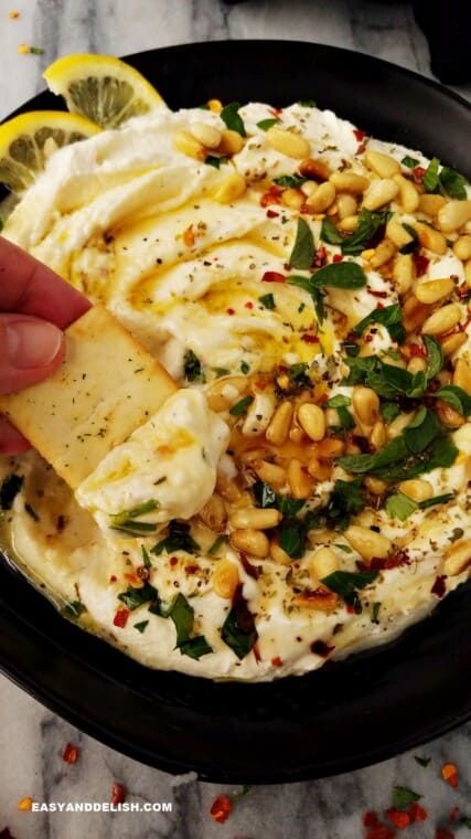 Whipped feta dip (similar to htipiti or tirokafteri) is a creamy Mediterranean appetizer that takes just 5 minutes to make. It’s a salty, garlicky, nutty, mildly sweet, sour, and spicy dip that is addicting! Serve with pita chips or crostini for sports games and parties, or as a healthy snack. What’s whipped feta? It is... The article Whipped Feta Dip (So Creamy) first appeared on Easy and Delish. Spicy Appetizer Recipes, Whipped Feta Dip, Mediterranean Appetizers, Roasted Carrots And Parsnips, Spicy Dip, Spicy Appetizers, Bon Apetit, Bite Size Appetizers, Feta Recipes