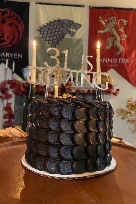 Game of Thrones Birthday Theme Party. I threw my own 31st birthday party and decided on GOT. I custom ordered this dragon scale cake and etsy ordered the cake topping that reads "31 is coming". Did a great food theme of a whole chicken roast, sour breads and cheese platter. Drank red wine and lit candles. Also had the fireplace going with GOT episodes playing in the background. Game Of Thrones Theme Party, Dragon Scale Cake, Game Of Thrones Birthday Cake, 31st Birthday Party, Fiesta Games, Game Of Thrones Halloween, Dragon Themed Birthday Party, Dragon Birthday Cakes, Game Of Thrones Birthday