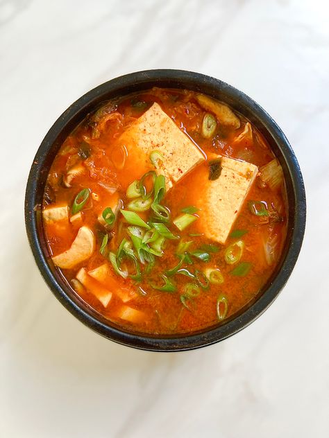 Having massive cravings for kimchi so I’ve decided to make “kimchi jjigae”!!🍲It never fails to hit the spot ☺️ Ingredients: - kimchi (the older the kimchi, the better for stews. It’s more funky & flavorful👌) - 1 egg - King oyster mushroom (1-2) - Tofu - 6 squares or so - Dried anchovies - a handful - Dried kelp - 2 1x1 in pieces - Water - 3 cups - Gochugaru (korean chili flake)1 tsp adjust to how spicy you want it - Gochujang (korean chili paste) 1 tbsp - adjust to how spicy you want it - Kimchi Jiggae Korean, Korean Kimchi Stew, Kimchi Soup Recipe, Kimchi Stew Recipe, Water Kimchi, Dried Anchovies, Korean Ingredients, Make Kimchi, Kimchi Jjigae