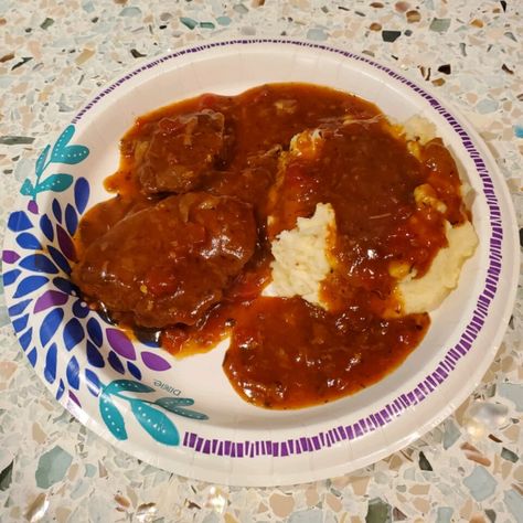 Pan-fried cube steaks are slow-cooked with onion and garlic in a tomato-based sauce for an easy version of a classic beef recipe. Easy Swiss Steak, Slow Cooker Swiss Steak, Swiss Steak Recipe, Swiss Steak Recipes, Steak And Onions, Swiss Steak, Cube Steak, Steak Recipe, Crockpot Recipes Slow Cooker