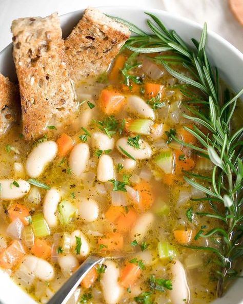 Jenn Laughlin on Instagram: "The ingredients for this cozy white bean soup are super simple and probably lurking in your pantry and crisper drawer as we speak! 🍲❤️ Cue the confetti and spirit fingers y’all! 🎉🙌🏻 Snag the recipe on peasandcrayons.com or click the link in my profile: @peasandcrayons . . . . #peasandcrayons #healthyfood #healthyeating #veggies #soup #souprecipe #whitebeansoup #hoorayveggies #glutenfree #glutenfreerecipes #soupseason #vegetablesoup #beansoup" Fried Mashed Potato Balls, Creamy Beans, Creamy White Beans, Olive Garden Minestrone Soup, Kingdom City, Soup Easy, Making Mashed Potatoes, Recipes For Two, Easy Soup