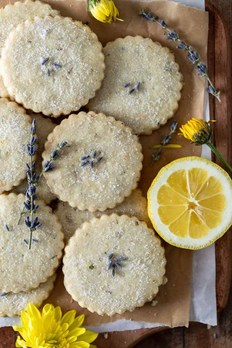 Brighten your day with the best lemon lavender shortbread cookies, an elegant twist on a timeless favorite. With the perfect blend of zesty citrus and soothing floral notes, these delicate, buttery cookies are guaranteed to bring a touch of sunshine to any spring or summer gathering. These lemon shortbread cookies with lavender are the perfect spring dessert idea to impress for Mothers Day, Easter, Bridal Showers, Baby Showers, or Tea Parties. You’ll fall in love with baking with lavender and Lavender Cookies Recipe, Cottage Core Baking, Lemon Lavender Cookies, Floral Food, Lavender Shortbread Cookies, Lavender Shortbread, Lavender Cookies, Lemon Shortbread, Lemon Shortbread Cookies