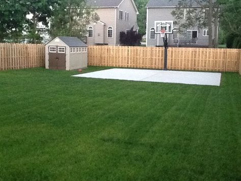 Beautiful green grass surrounds a new basketball court. Shed Basketball Court, Basketball Backyard, Backyard Amenities, Backyard Basketball Court, Backyard Court, Home Basketball Court, Basketball Court Backyard, Backyard Sports, Backyard Basketball