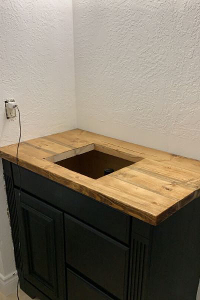 Easy Do It Yourself Vanity Update Diy Wood Countertops Bathroom, Black Bathroom Vanity With Wood Top, Tiled Vanity Top, Dark Blue Master Bath, Wooden Bathroom Vanity Top, Black Washroom Vanity, Diy Bathroom Vanity Cabinet, Butcher Block Vanity Top, Butcher Block Vanity Top Bathroom