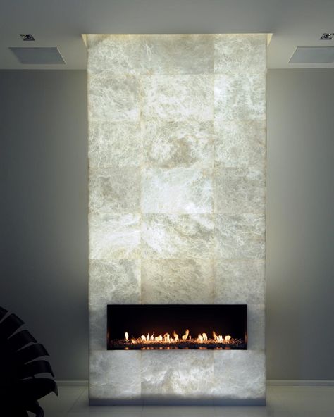 This bright #backlit alabaster fireplace looks wonderful against the warm natural light of the flames. Part of Project Cheminée, Paris. #luxuryinteriors #interiordesign #design #luxurydesign #architecture #modern #contemporary #fireplace #livingroom #alabaster #marble #fire #homedecor #home Contemporary Fireplace Designs, Comfy House, Fireplace Tv Wall, Fire Places, Contemporary Fireplace, Home Fireplace, Modern Fireplace, Fireplace Tile, Fireplace Wall