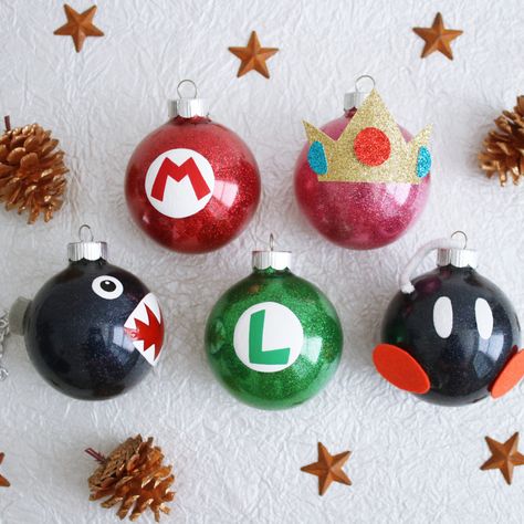 Fun Super Mario themed Holiday Ornaments Mario Xmas Tree, Diy Mario Ornaments, Nintendo Christmas Tree, Super Mario Christmas Ornaments, Super Mario Bros Christmas Tree, Mario Ornaments Diy, Mario Bros Christmas Tree, Super Mario Ornaments, Super Mario Crafts