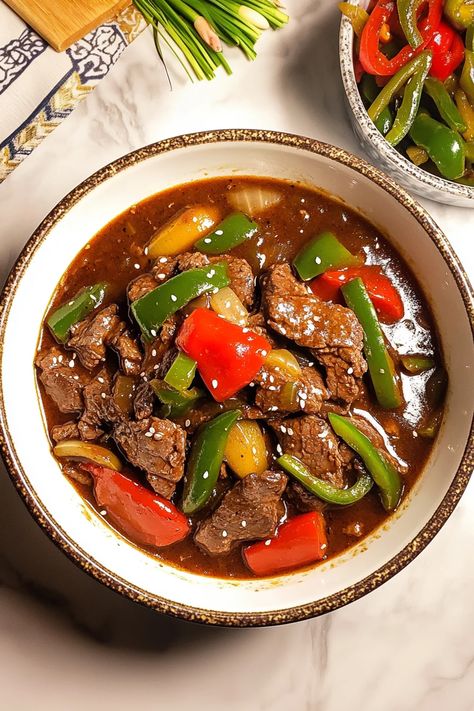 This Crockpot pepper steak recipe delivers tender beef strips and colorful bell peppers simmered in a savory, slightly sweet sauce. The slow cooker brings out incredible flavors, making it the perfect easy dinner for busy nights. Try this recipe today – see full instructions #crockpotrecipes #peppersteak #beefrecipes #easymeals #slowcooker #comfortfood #weeknightdinner #asianinspired #slowcooked Beef With Black Bean Sauce, Black Bean Garlic Sauce, Beef In Black Bean Sauce, Crockpot Pepper Steak, Crockpot Stuffed Peppers, Pepper Steak Recipe, Bean Sauce, Black Bean Sauce, Healthy Weeknight Meals